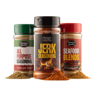 Three seasoning bottles labeled All Purpose Seasoning, Jerk Seasoning, and Seafood Blends with spice piles in front